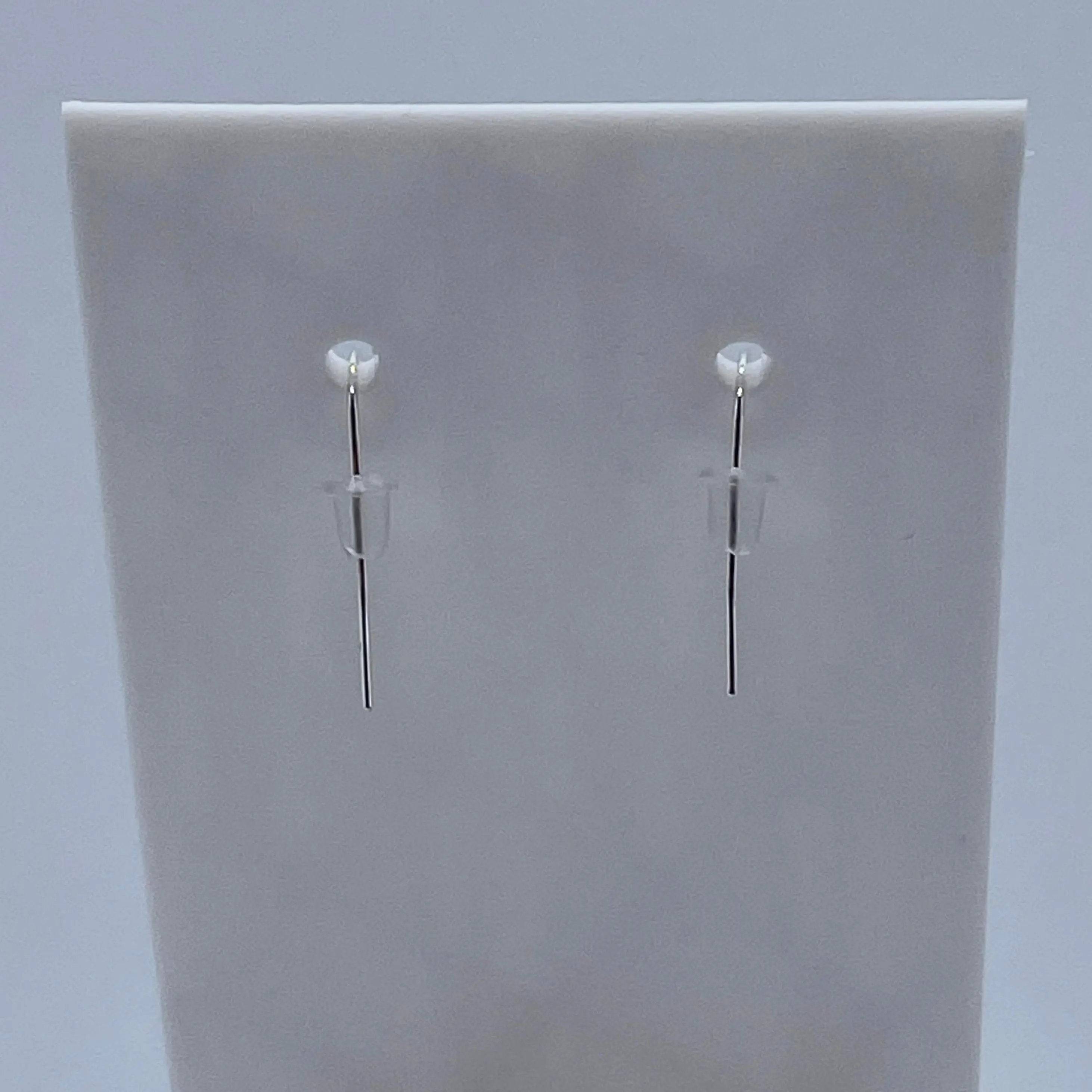 Double Helix DNA Dangle Earrings are made with sterling silver hooks and silicone backs.