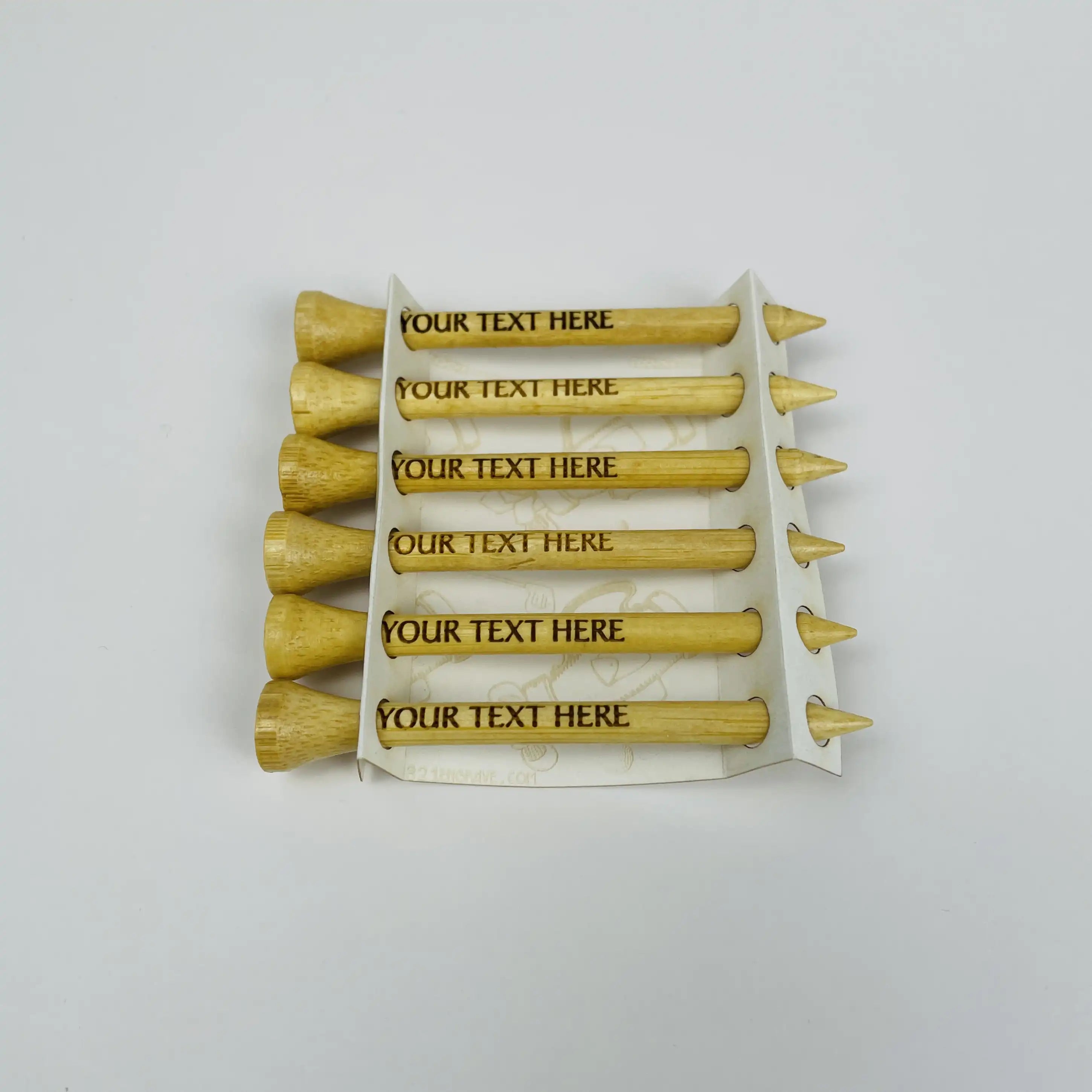 Set of wooden golf tees with customizable text on a white background