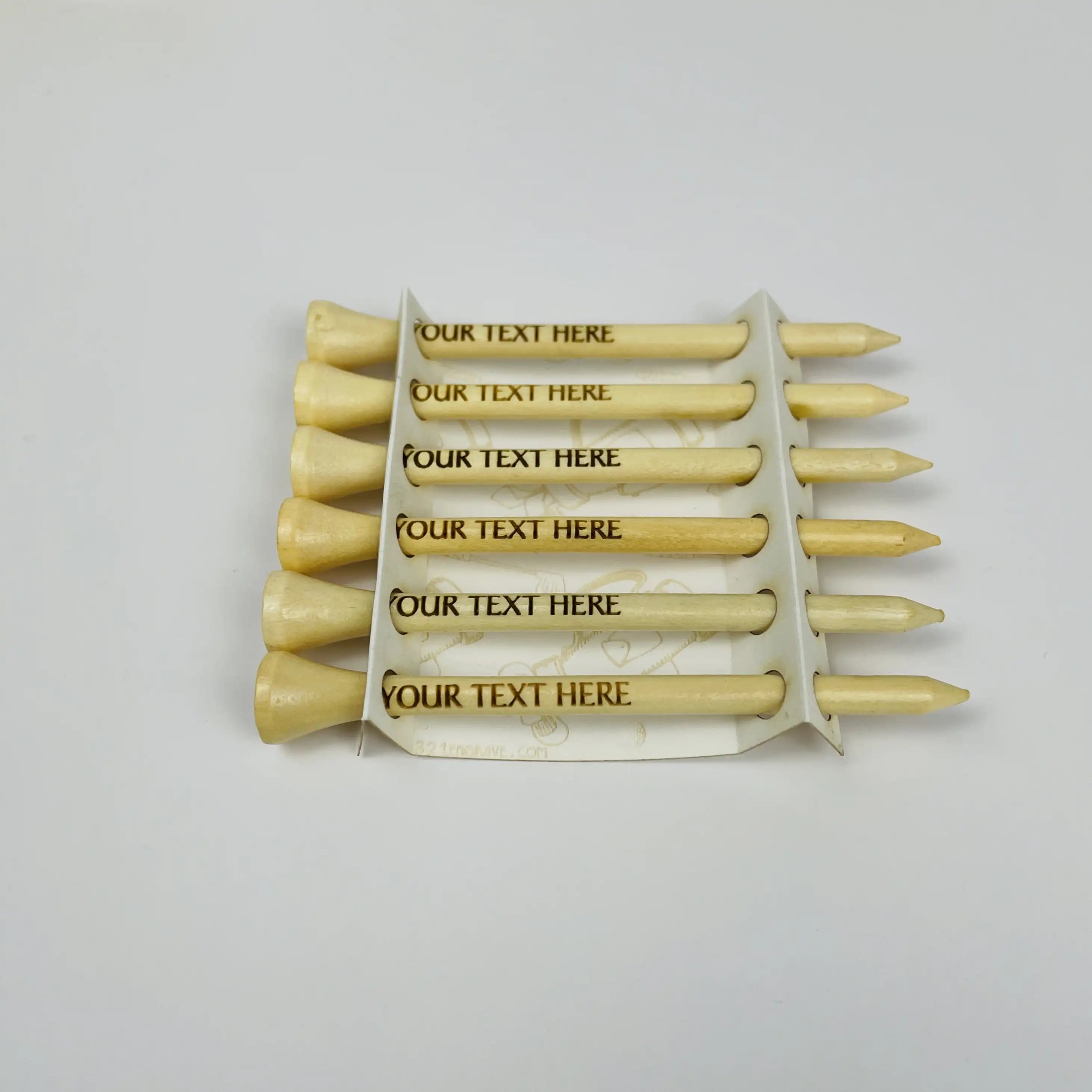 Set of personalized wooden tees with 'Your Text Here' text on a white background