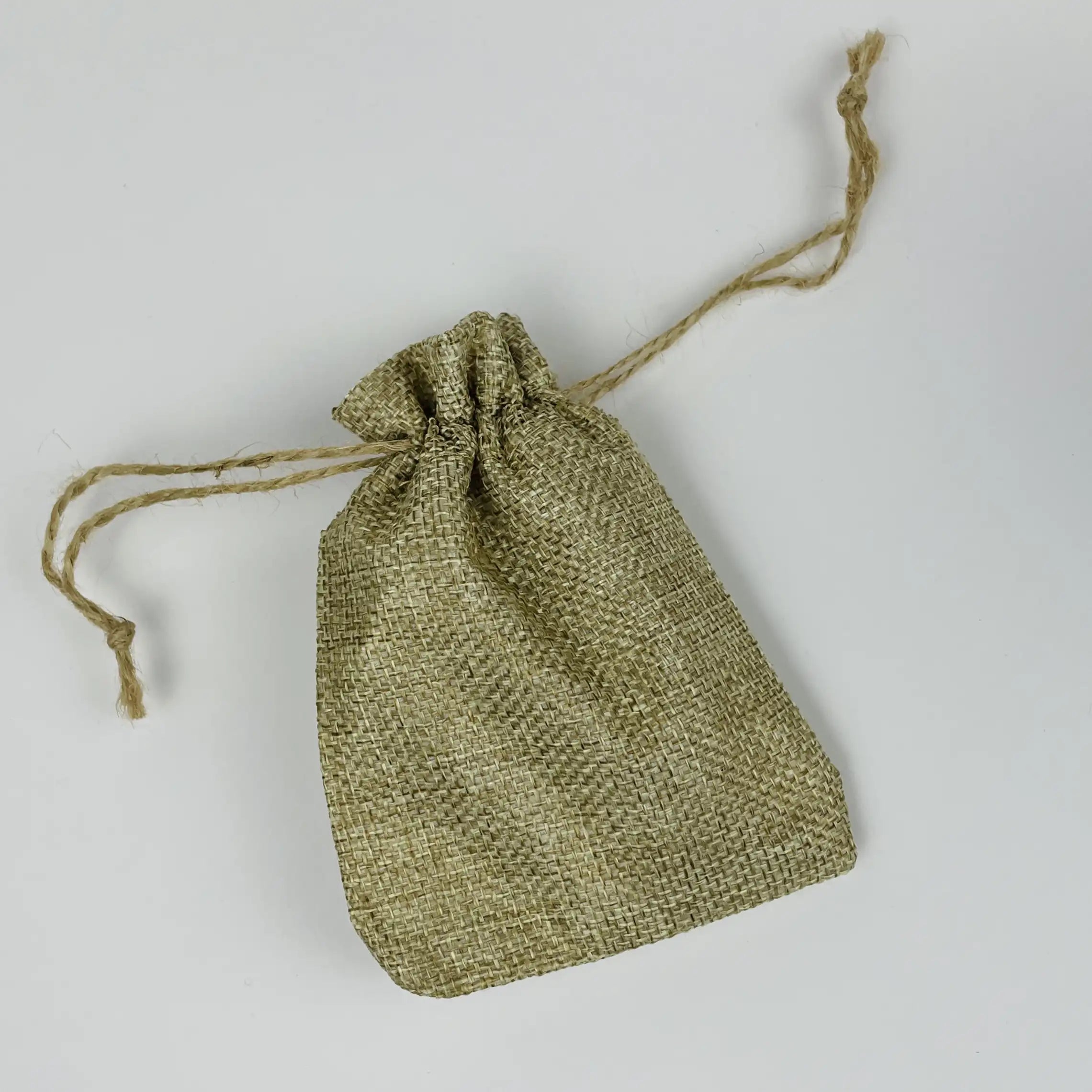 Textured tan drawstring bag on a light gray background