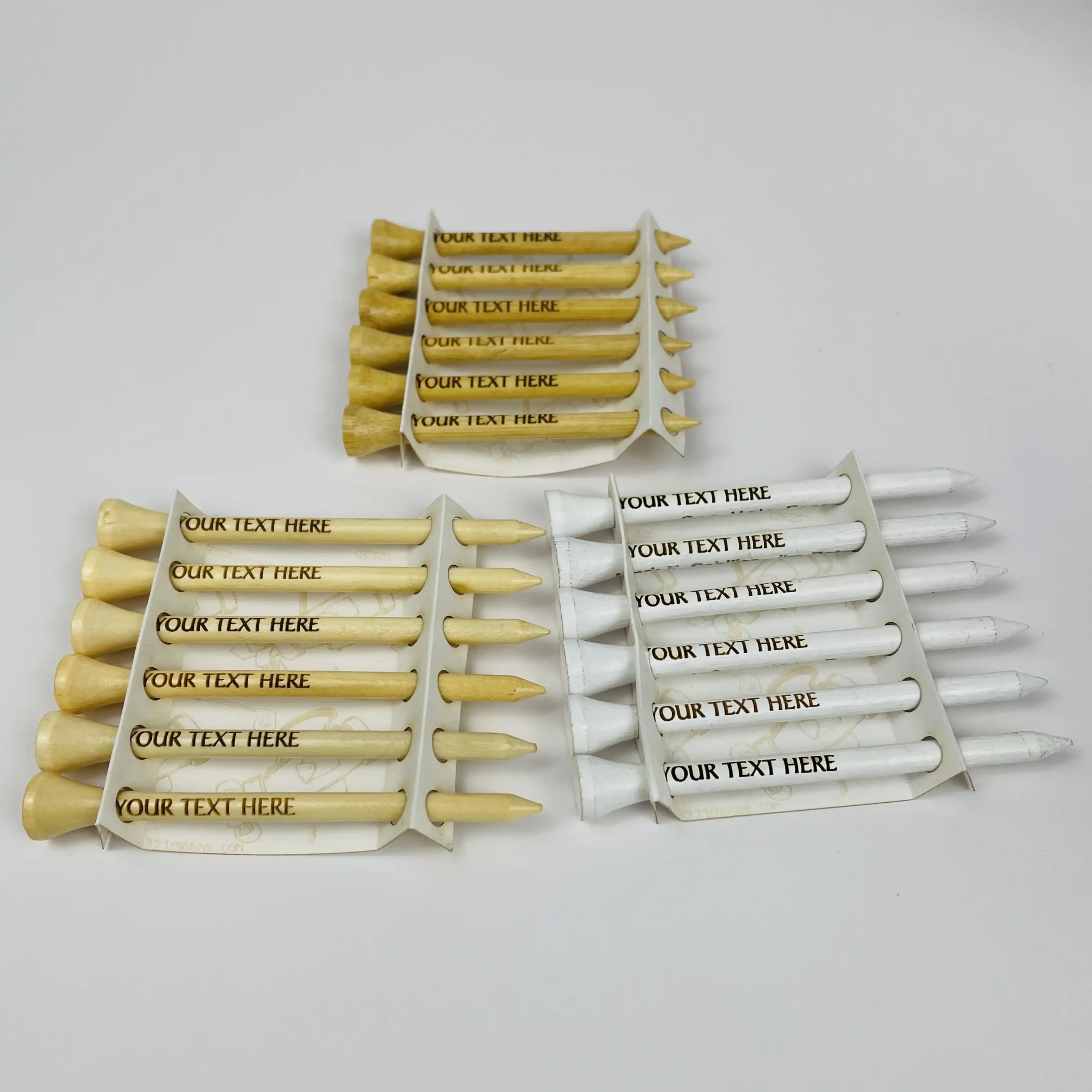Set of personalized golf tees with customizable text on a white background